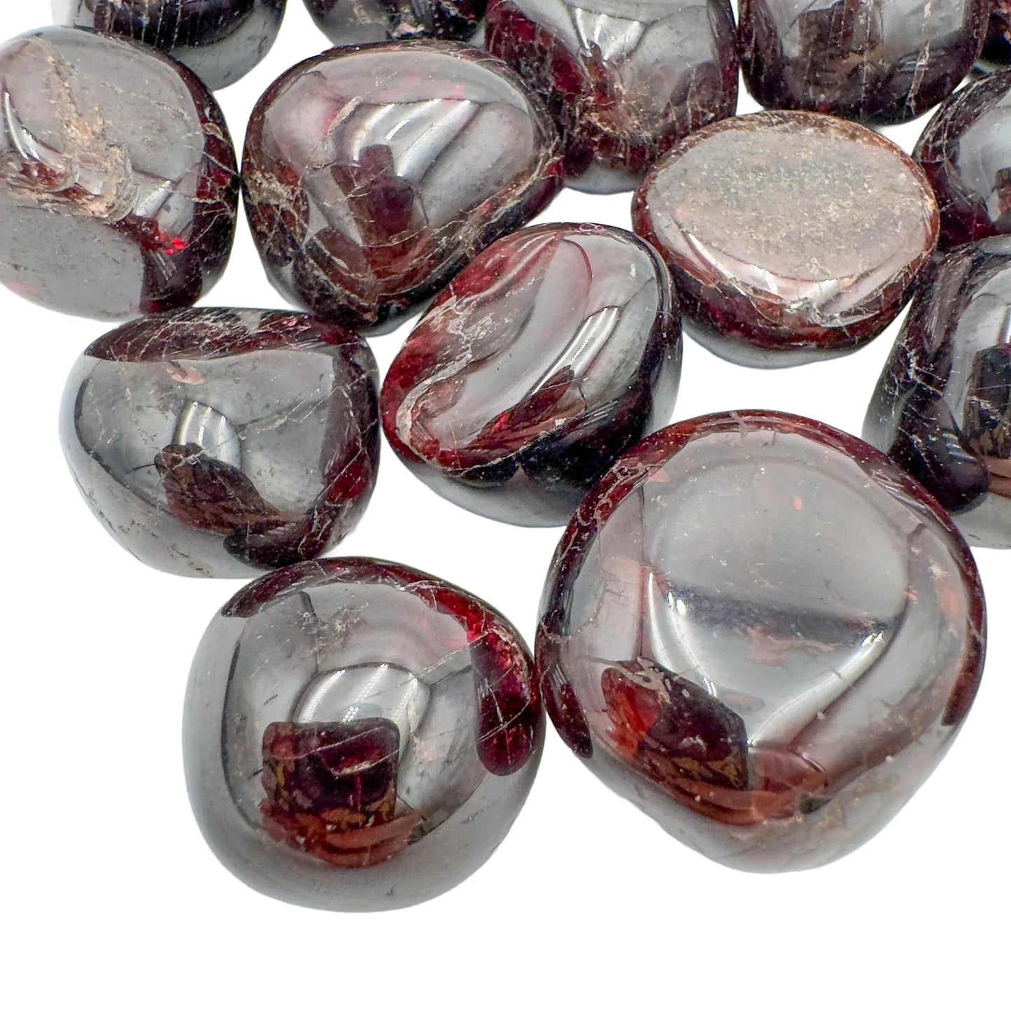 Top-side view of Garnet tumbled stone, kept near for Energy and Confidence, showing natural inclusions.