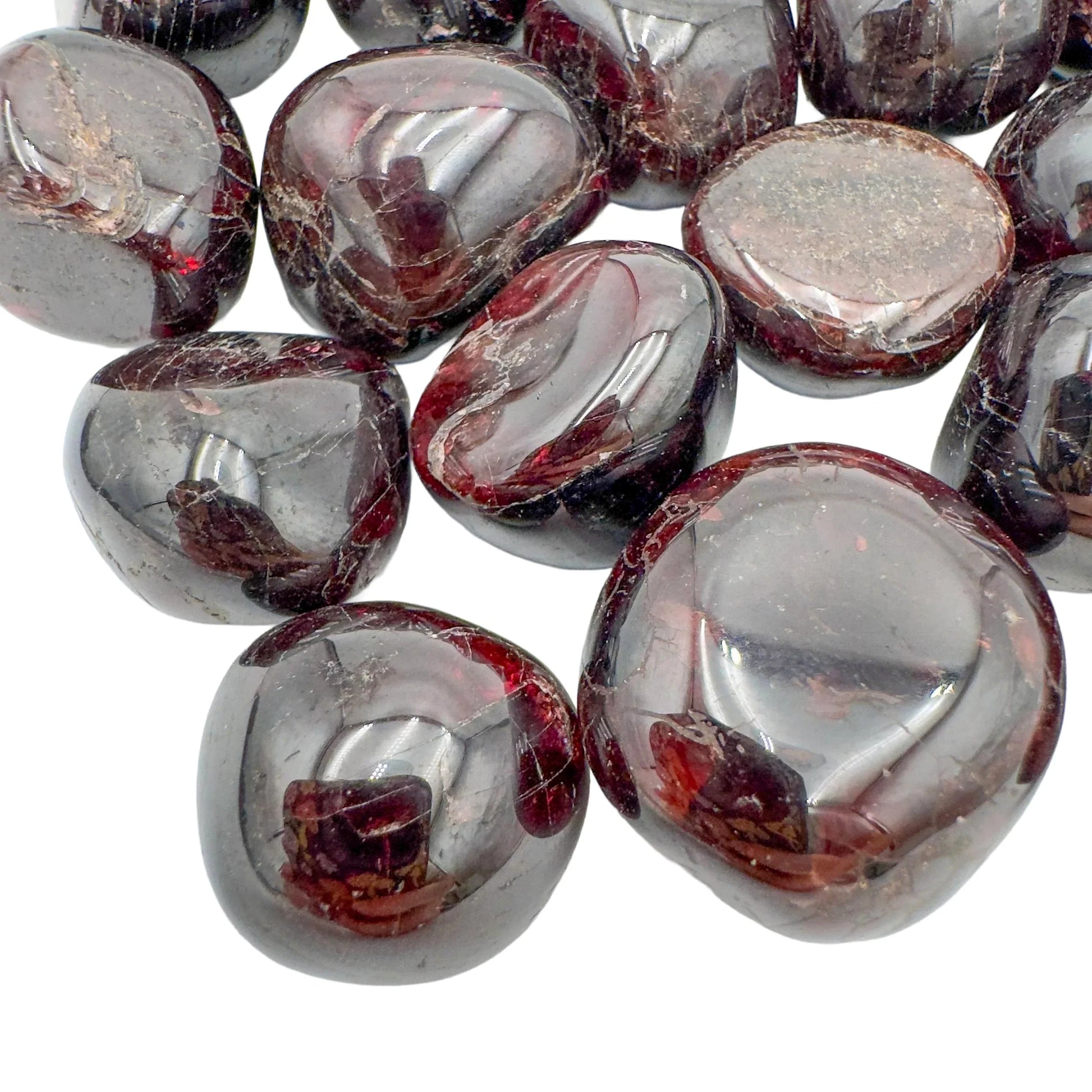 Top-side view of Garnet tumbled stone, kept near for Energy and Confidence, showing natural inclusions.