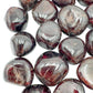 Underside view of Garnet tumbled stone, sourced from Malawi, to support Energy and Confidence.
