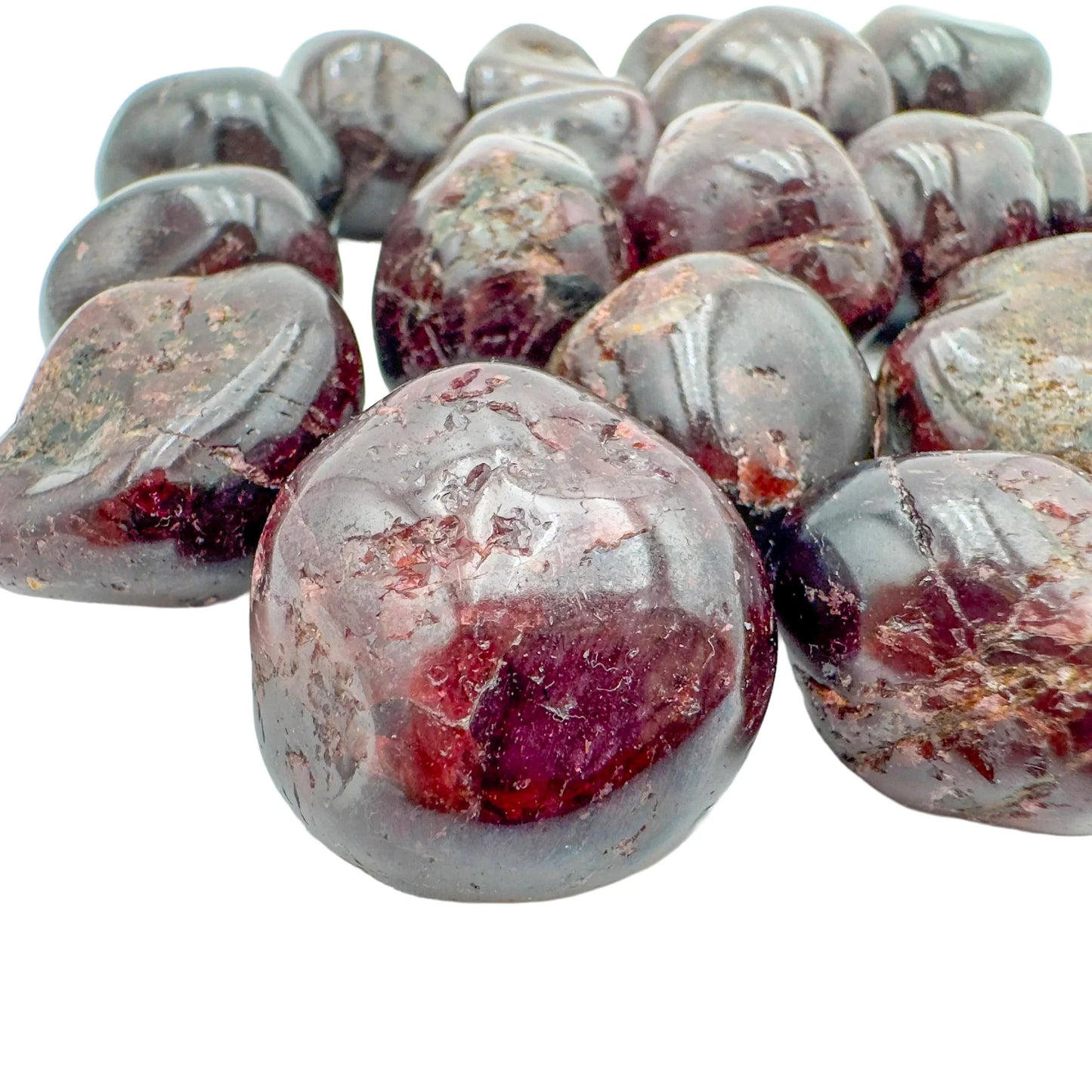 Near view of Garnet tumbled stone, sourced from Minas Gerais, Brazil, showing characteristic color.
