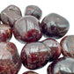Rear view of Garnet tumbled stone, sourced from Minas Gerais, Brazil, for Energy and Confidence.