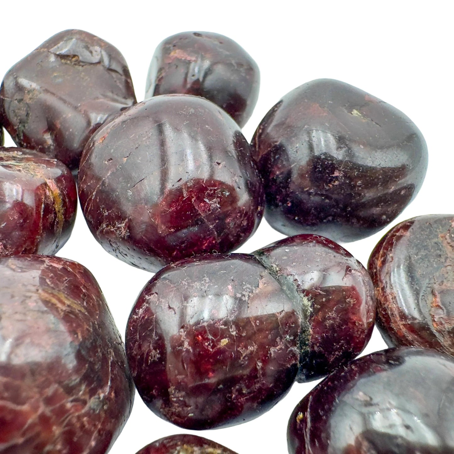 Rear view of Garnet tumbled stone, sourced from Minas Gerais, Brazil, for Energy and Confidence.