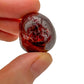 Back view of Grade AA Garnet tumbled stone showing natural surface