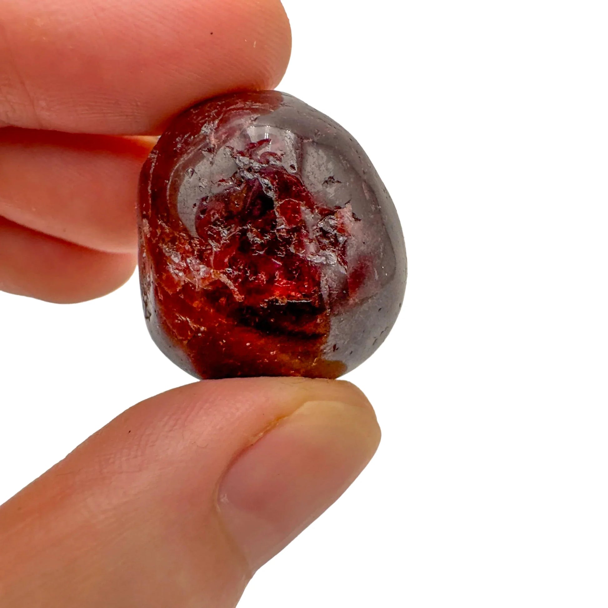 Back view of Grade AA Garnet tumbled stone showing natural surface