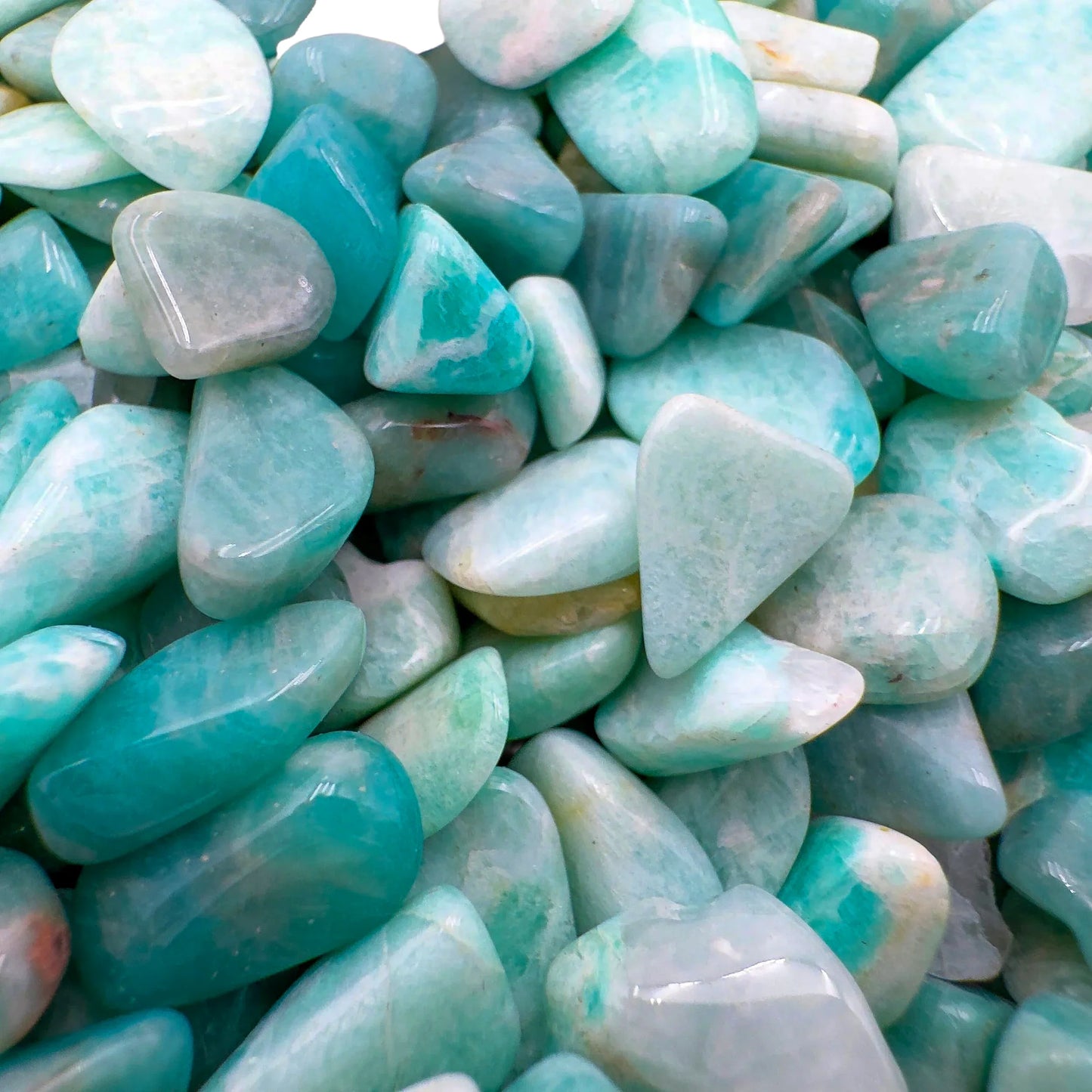 Side-on view of Amazonite polished chip, showing matte finish, linked to Stress Relief.