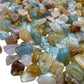 Top-side view of Grade A Aquamarine polished chip, from Huila, Angola, showing natural variation.