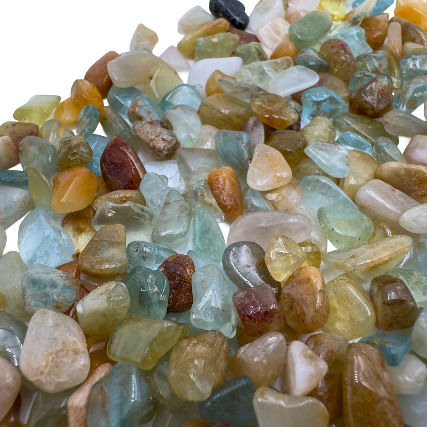 Scale reference of a Aquamarine polished chip associated with Courage and Clarity.