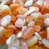 Color detail of Grade A orange Carnelian polished chip, sourced from Francistown.