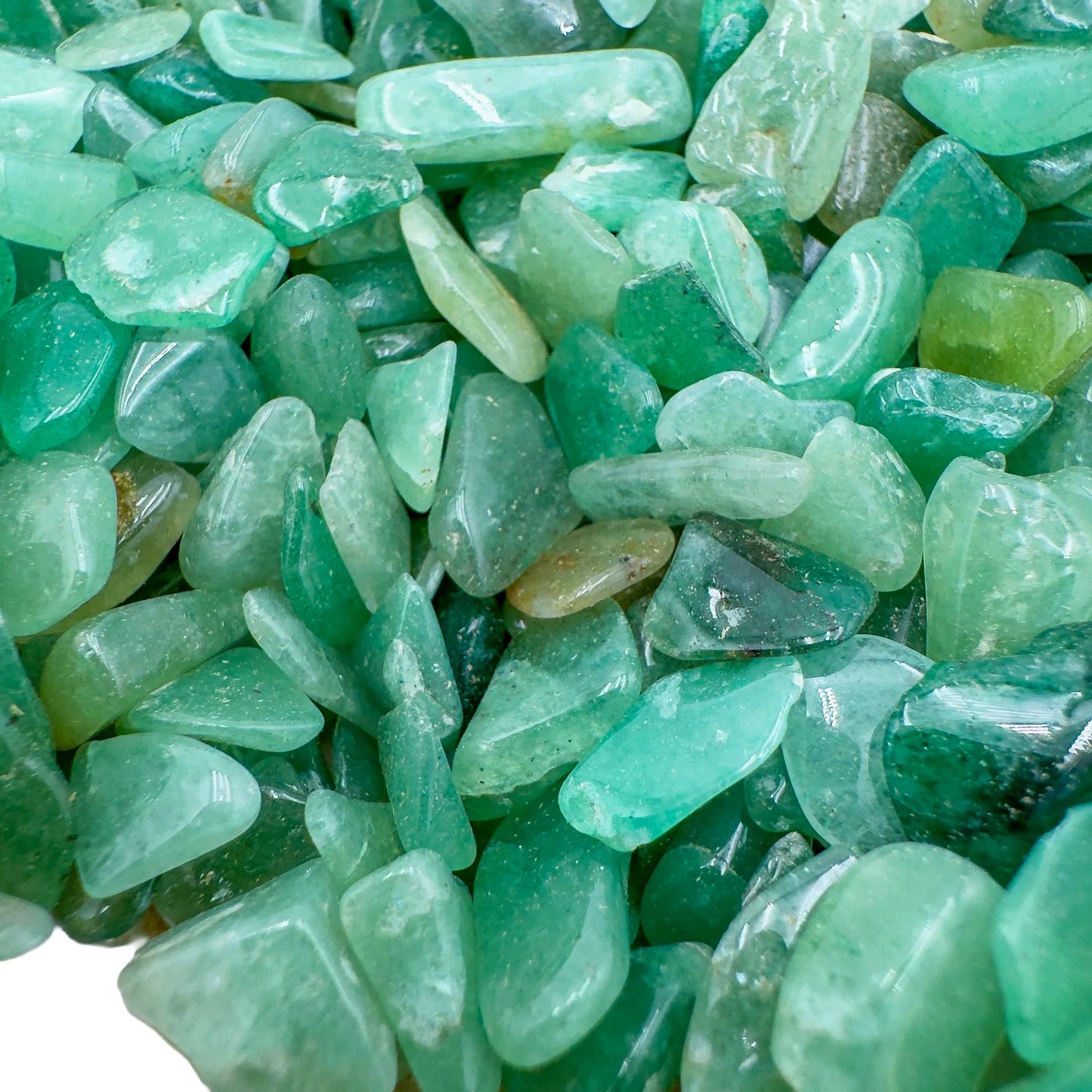 Detail capture of Aventurine polished chip, showing glassy finish, turned to for Luck.