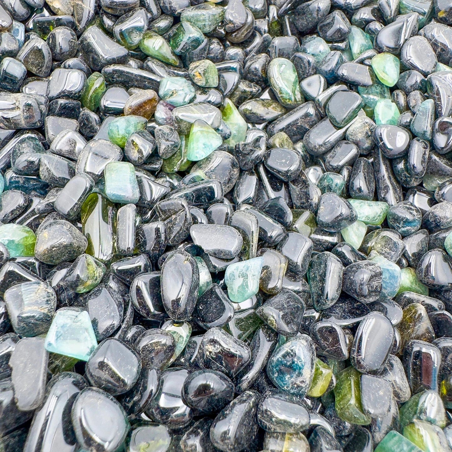 Bird's-eye view of Green Tourmaline polished chip, showing characteristic color, from Mozambique.