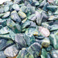 Detail of Kambaba Jasper polished chip, showing characteristic color, linked to Grounding and Stress Relief.