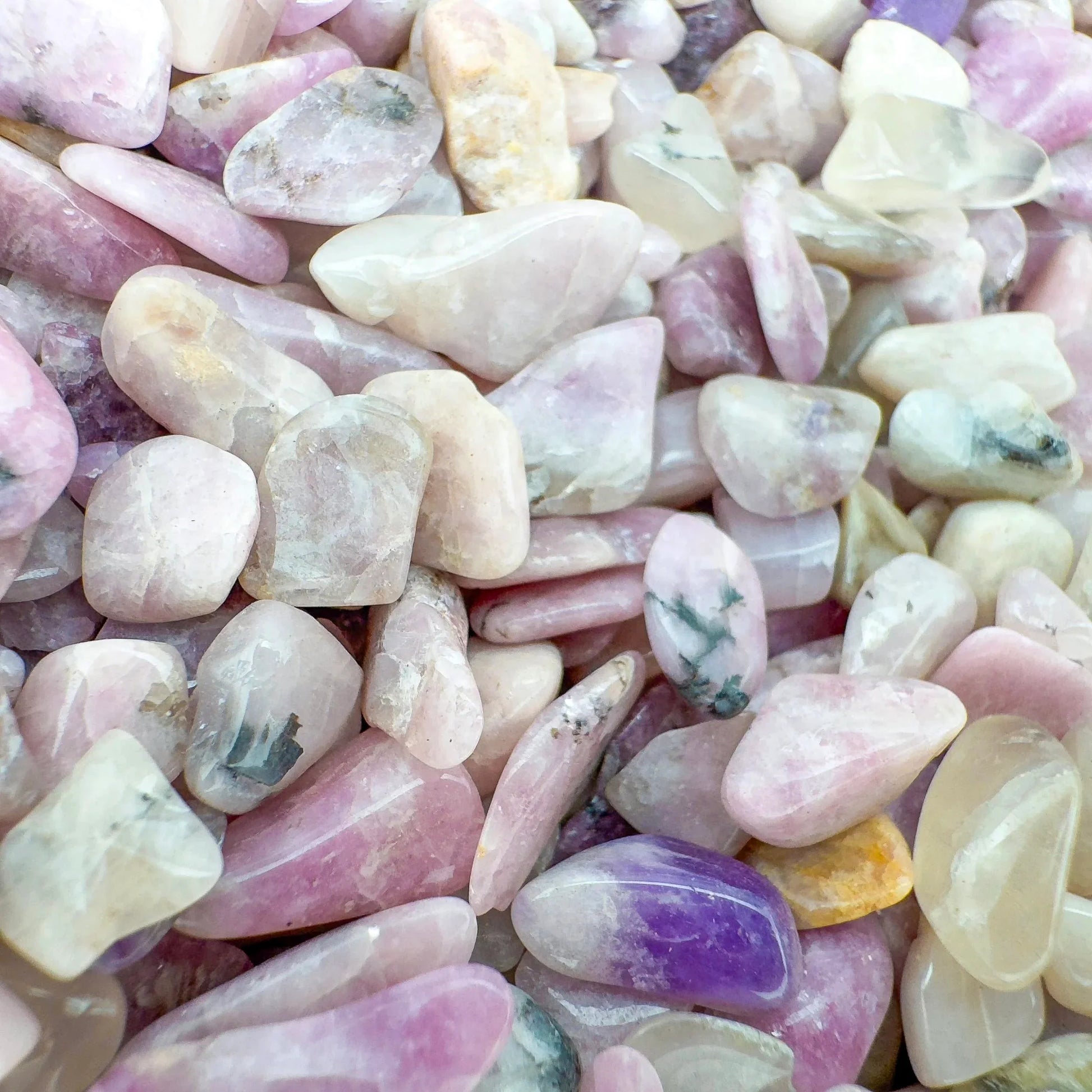 Overhead angle of Lepidolite polished chip, carried for Stress Relief and Emotional Healing, showing natural texture.