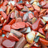 Detail of Grade A Red Jasper polished chip, showing translucent edges, from Northern Cape, South Africa.