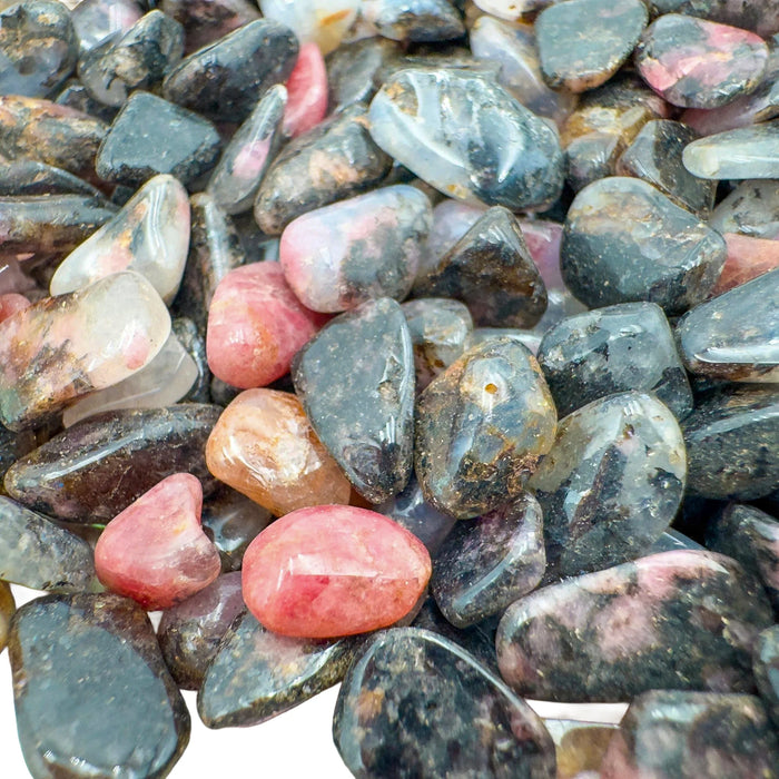 Detail capture of Rhodonite polished chip, showing soft luster.