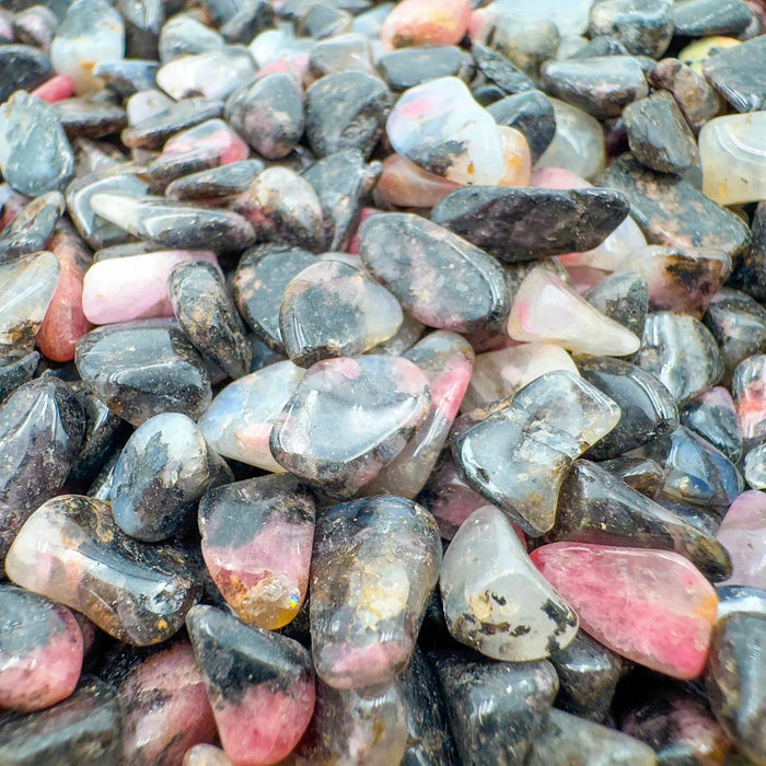 Edge view of Rhodonite polished chip, showing characteristic finish.