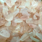 Lateral view of Rose Quartz polished chip, South Africa-sourced, showing subtle veining.