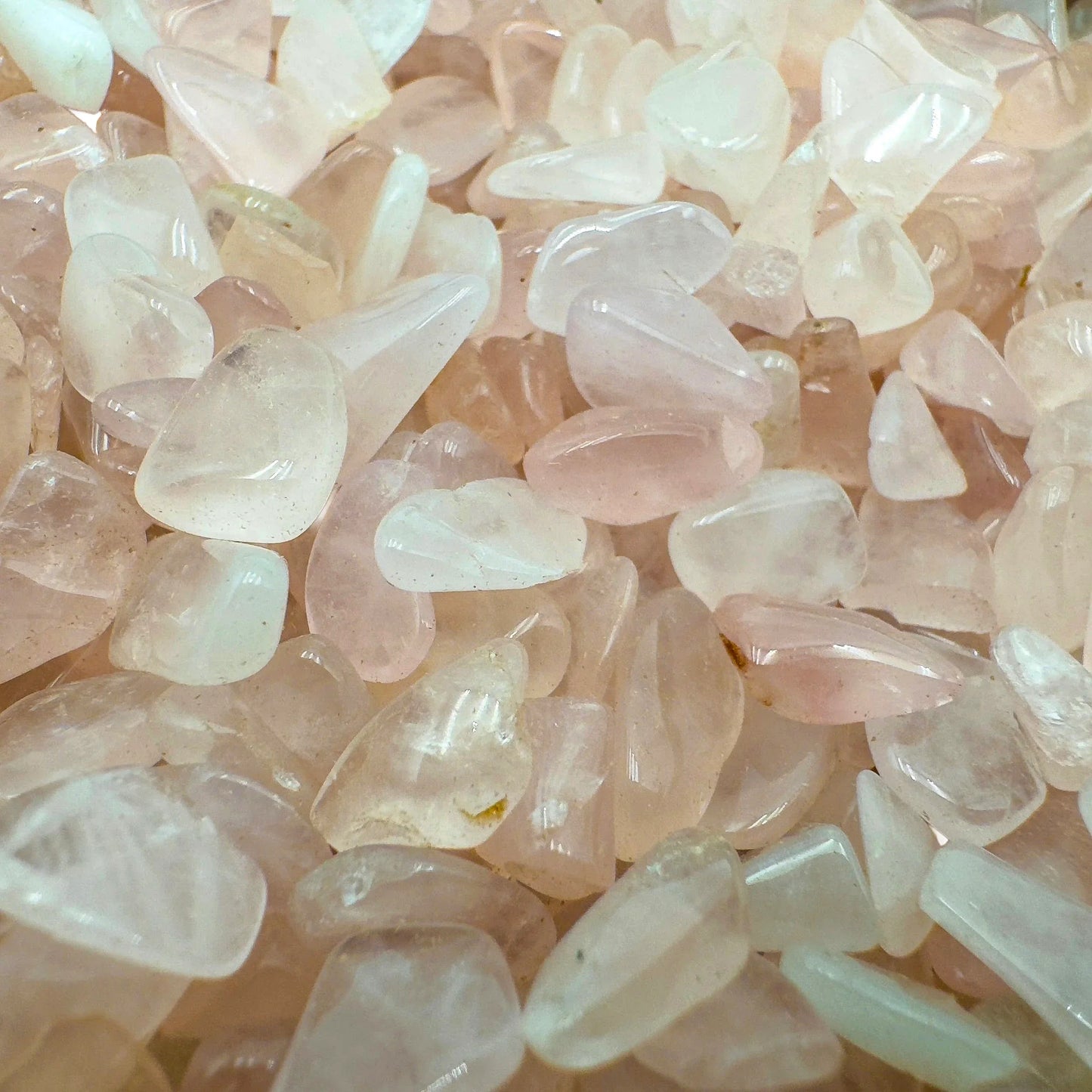 Lateral view of Rose Quartz polished chip, South Africa-sourced, showing subtle veining.