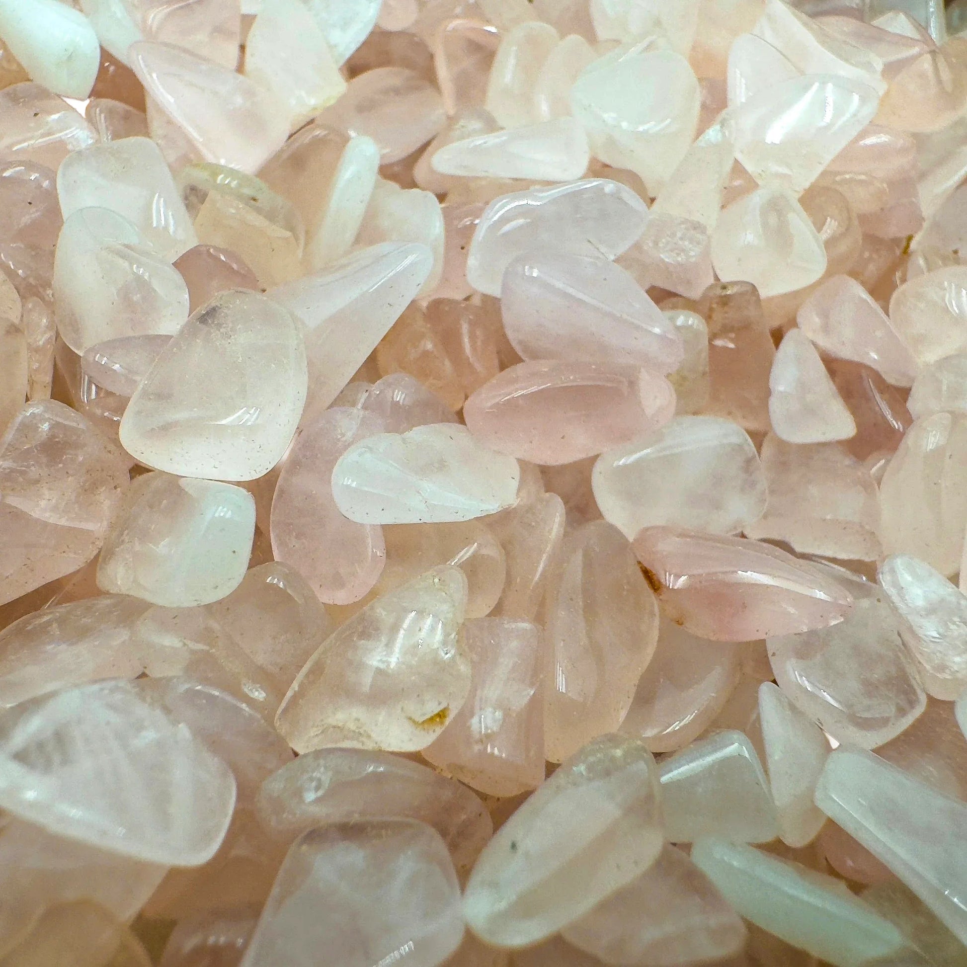 Lateral view of Rose Quartz polished chip, South Africa-sourced, showing subtle veining.