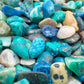 Detail capture of Grade A blue Chrysocolla polished chip, kept close for Emotional Healing.