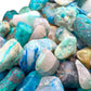Top-side view of Chrysocolla polished chip, often worked with for Emotional Healing and Stress Relief, showing natural inclusions.
