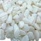 Up-close view of Grade A Snow Quartz polished chip, showing glassy finish.