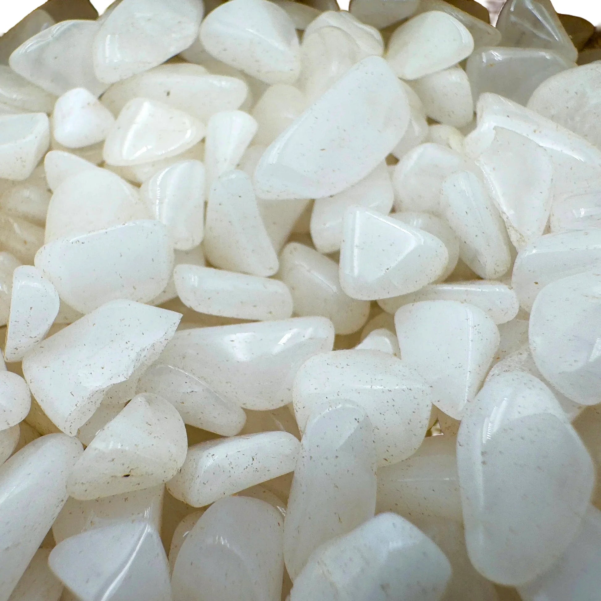 Side-on view of Grade A Snow Quartz polished chip, showing subtle veining, hand-selected from Zambezia Province, Mozambique.