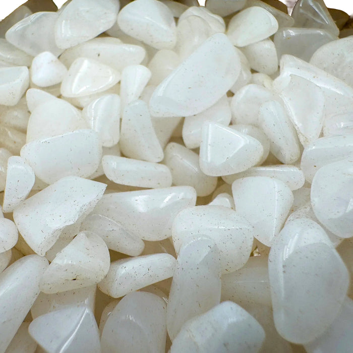 Side-on view of Grade A Snow Quartz polished chip, showing subtle veining, hand-selected from Zambezia Province, Mozambique.