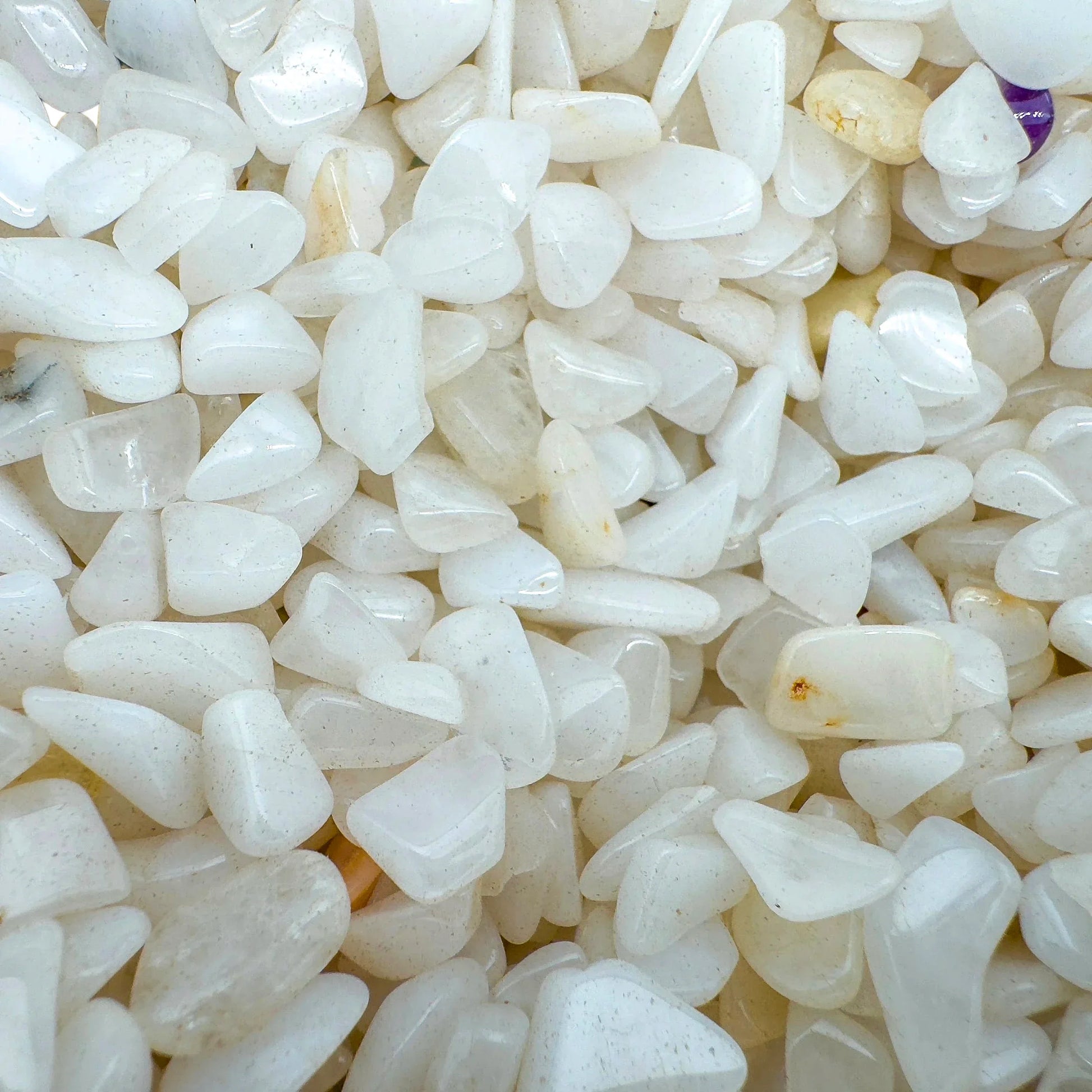 Top-side view of Grade A Snow Quartz polished chip, linked to Meditation and Stress Relief, from Mozambique.