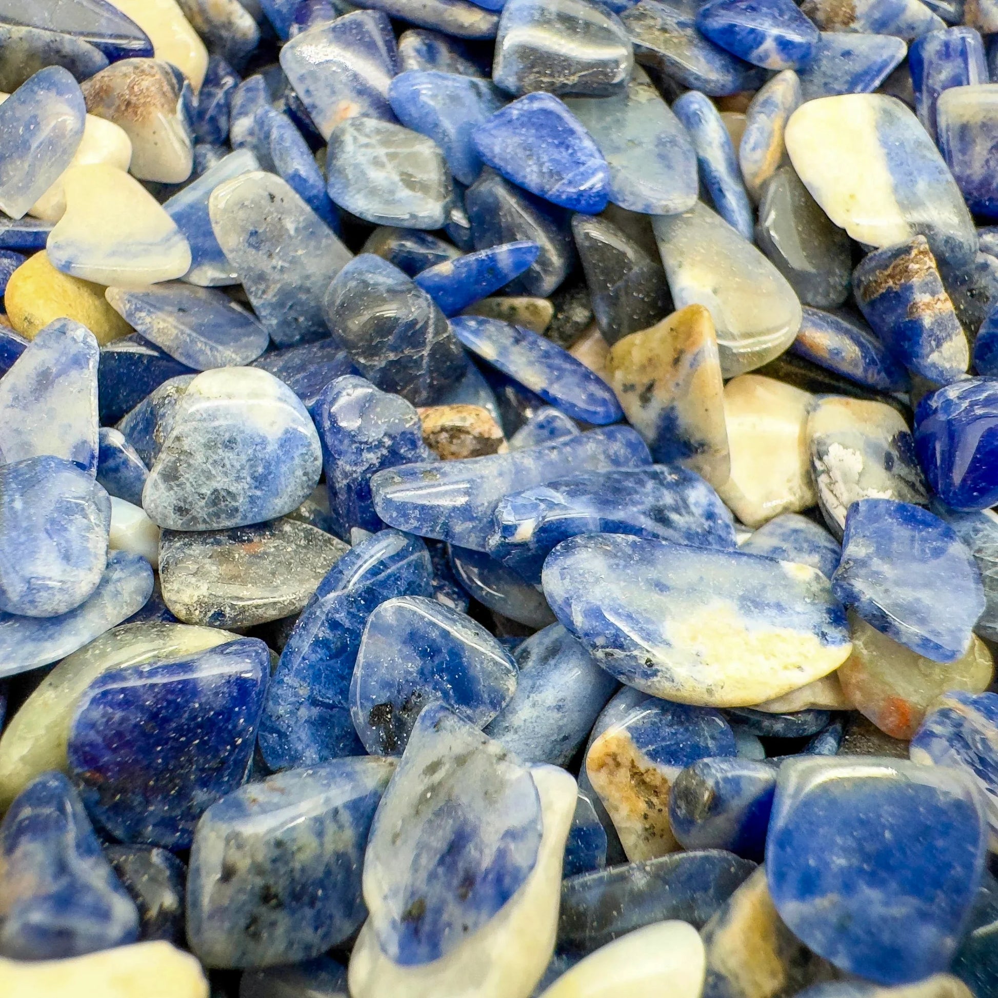 Top view of blue Sodalite polished chip, showing subtle veining, from Namibia.