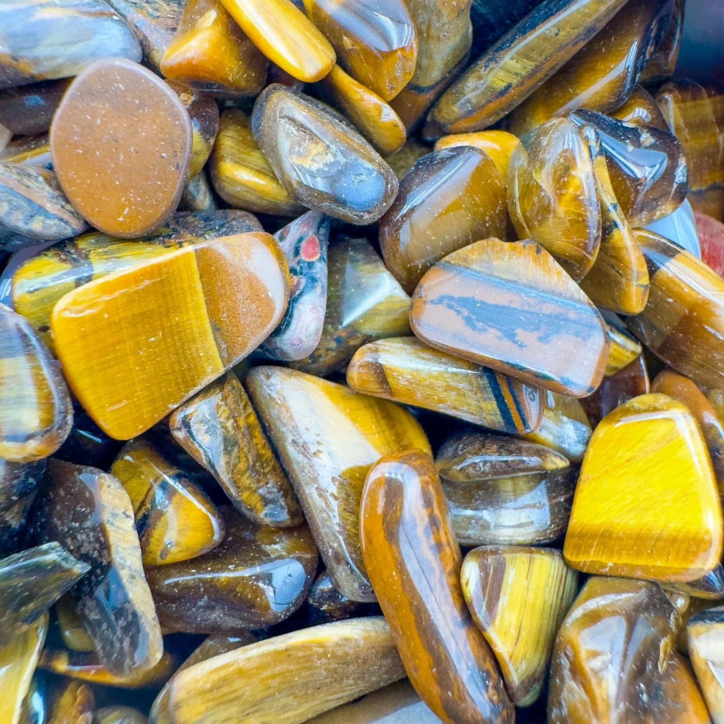 Overhead angle of Tiger Eye polished chip, sourced from Northern Cape, South Africa.