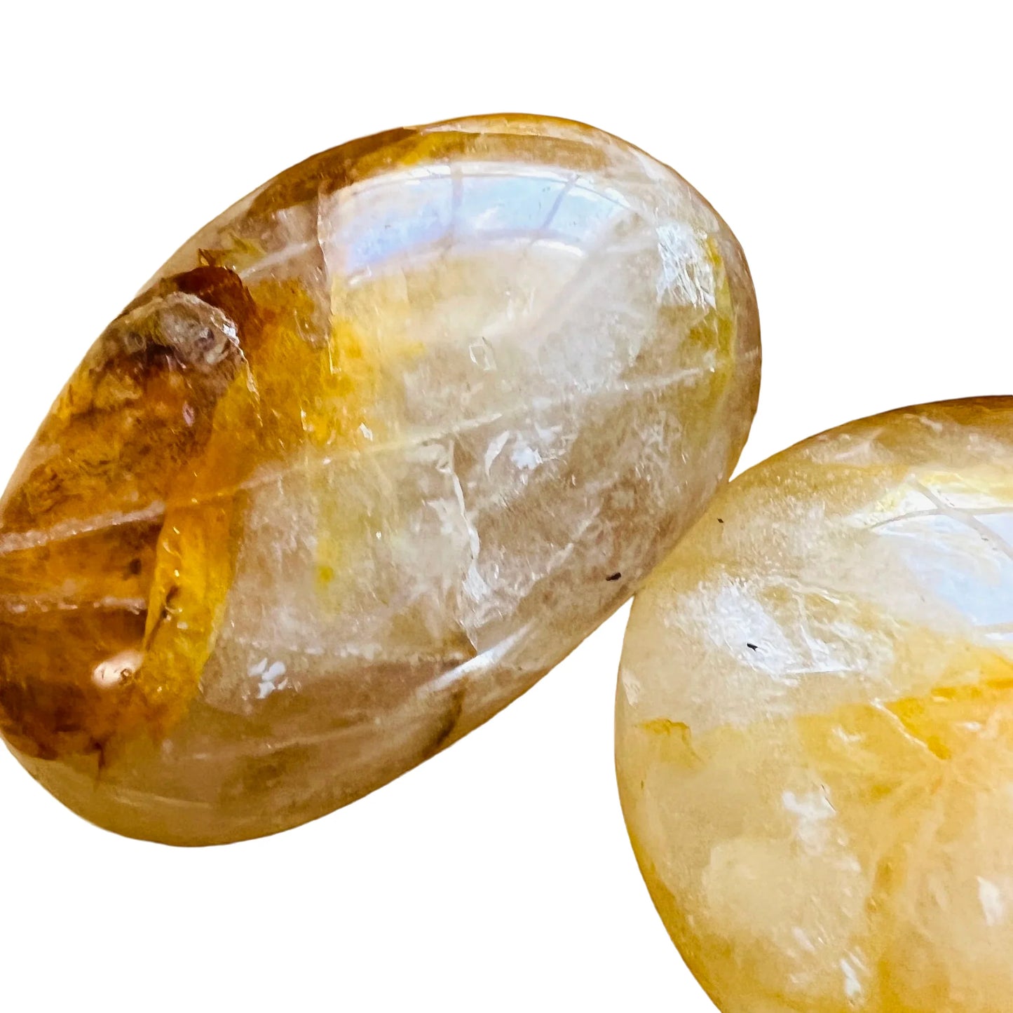Overhead view of Golden Healer palm stone, turned to for Healing, showing earthy tone.