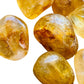 Overhead view of Golden Healer tumbled stone, hand-selected from Minas Gerais, Brazil, associated with Healing.