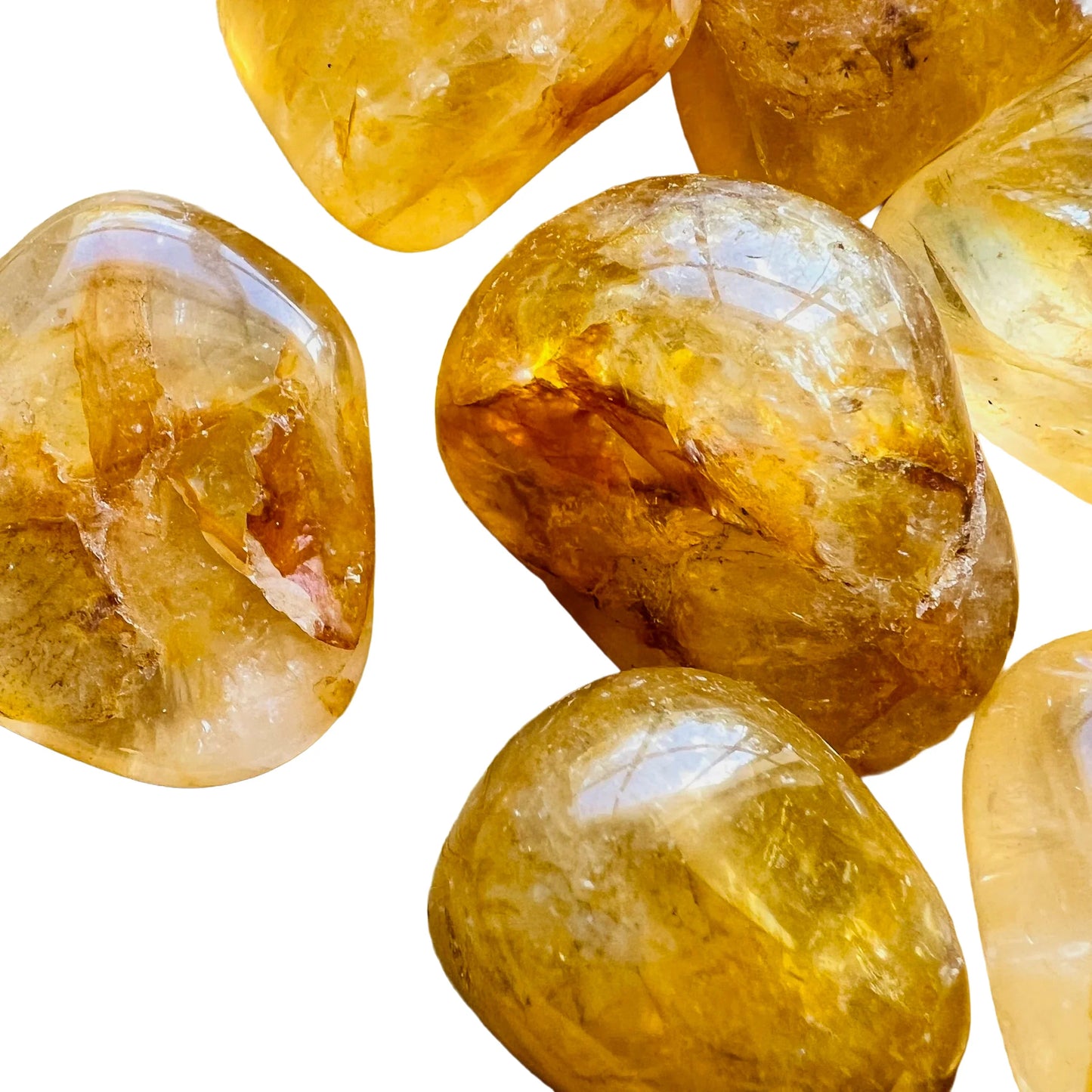 Overhead view of Golden Healer tumbled stone, hand-selected from Minas Gerais, Brazil, associated with Healing.