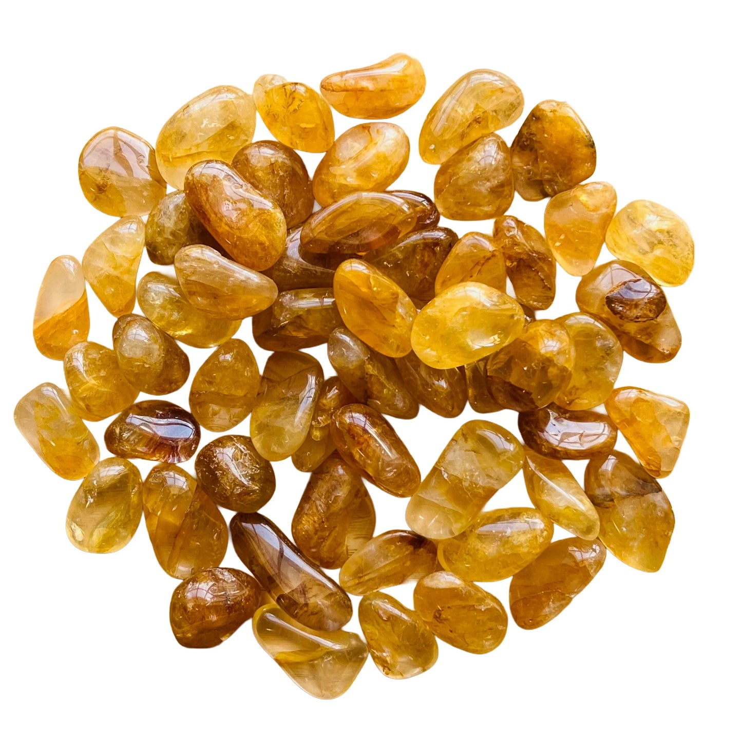 Companion image of Golden Healer tumbled stone, from Minas Gerais, Brazil, associated with Cleansing, set against a soft neutral surface.