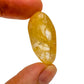 Back view of Grade AAA Golden Healer tumbled stone showing natural surface