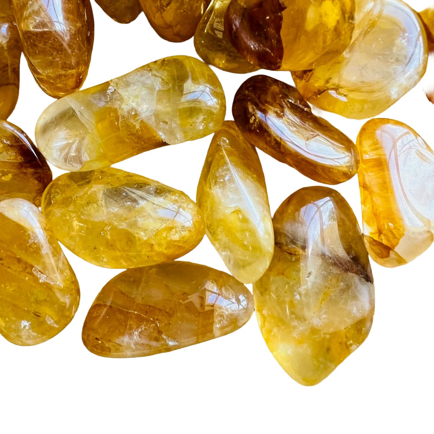 Detail shot of Grade AAA Golden Healer tumbled stone under natural light