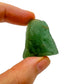 Hand-scale shot of a Aventurine raw stone held against natural backdrop, hand-selected from Minas Gerais, Brazil.