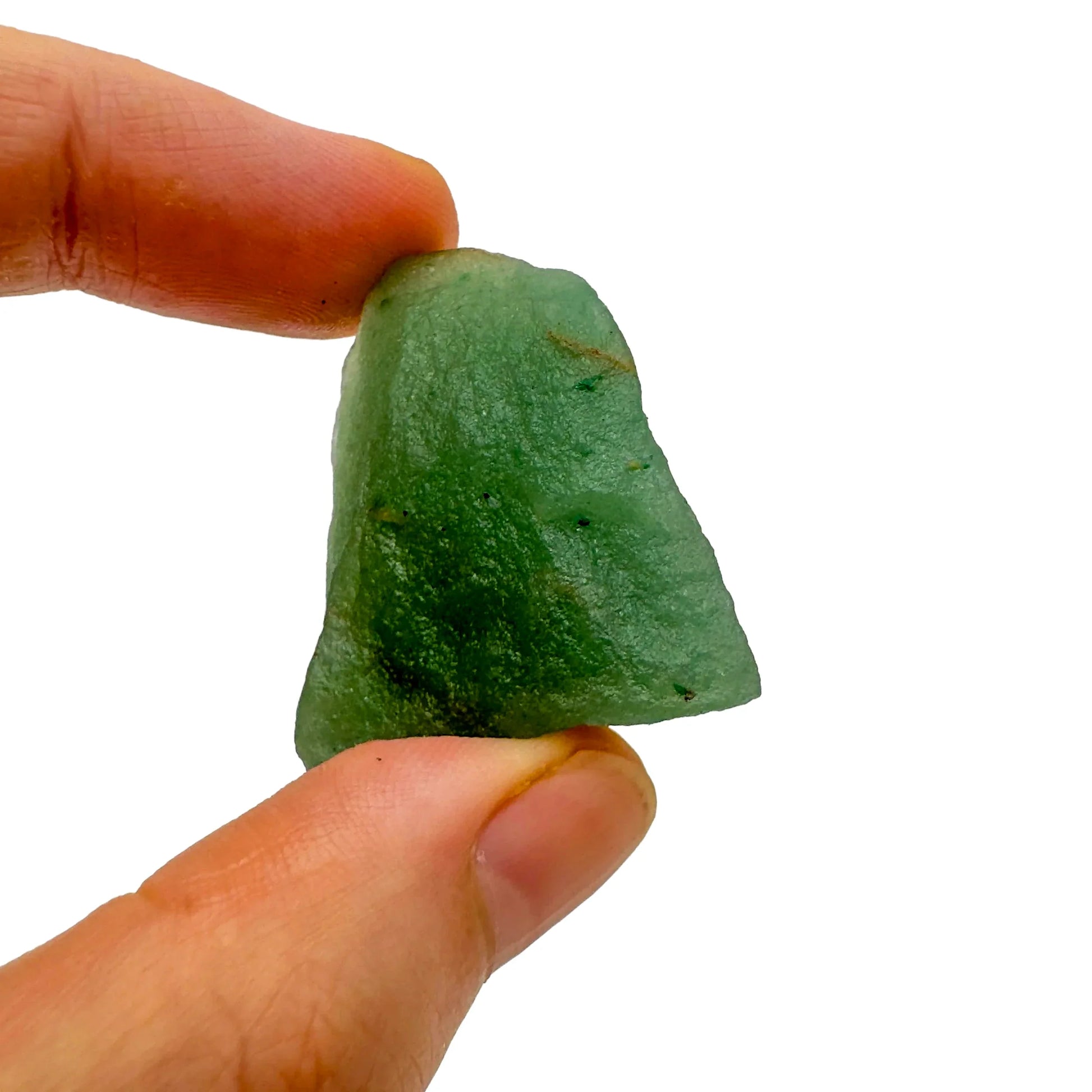 Hand-scale shot of a Aventurine raw stone held against natural backdrop, hand-selected from Minas Gerais, Brazil.