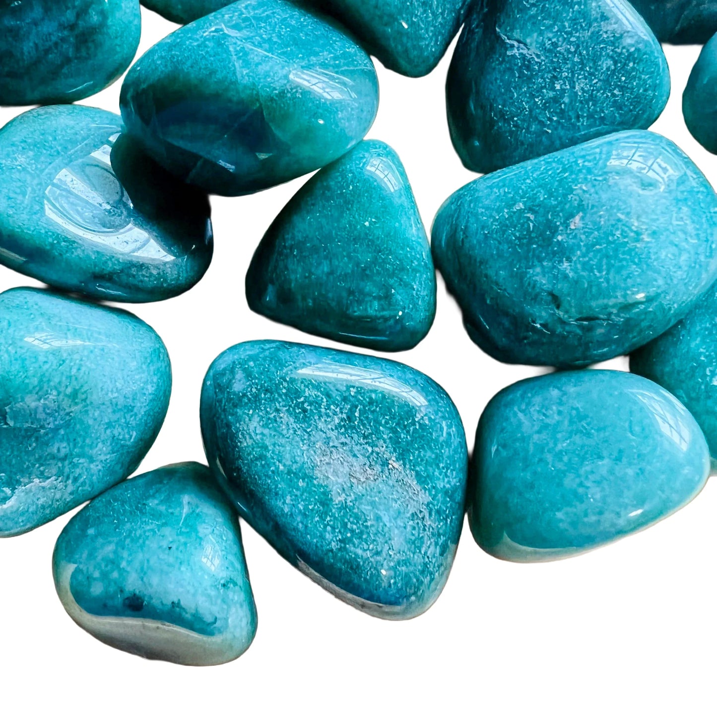 Bird's-eye view of Grade AA Aventurine tumbled stone, hand-selected from Minas Gerais, Brazil.