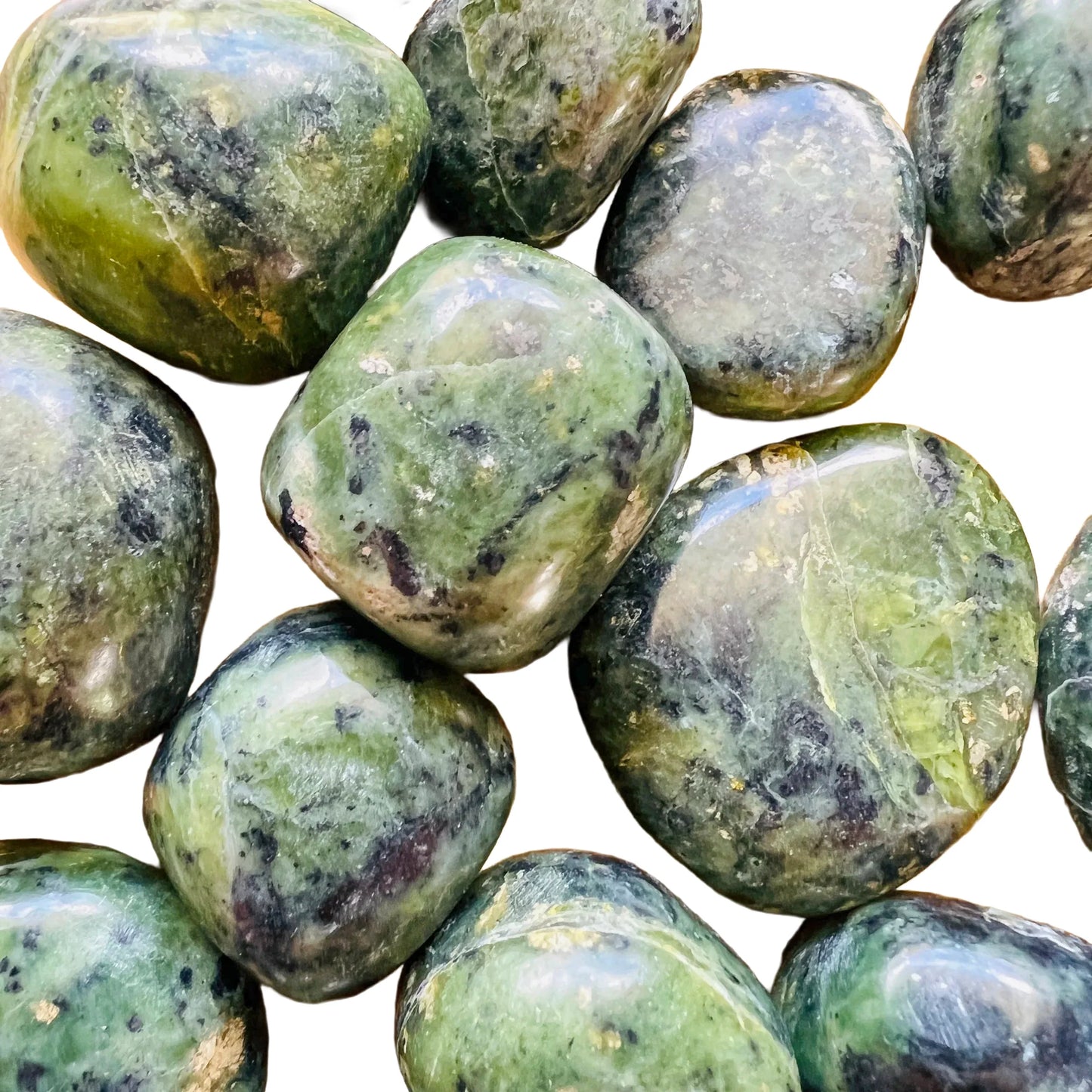 Texture-level view of Jade tumbled stone, showing earthy tone, linked to Luck and Abundance.