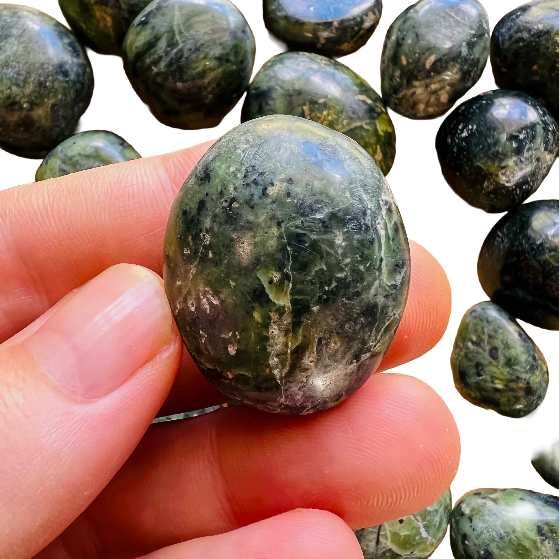 Back view of Grade A Jade tumbled stone showing natural surface