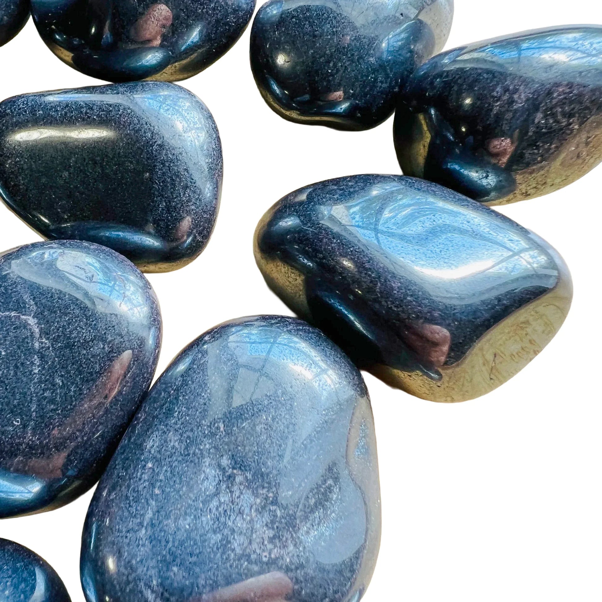 Lifestyle view of a single Hematite tumbled stone from Minas Gerais, Brazil.