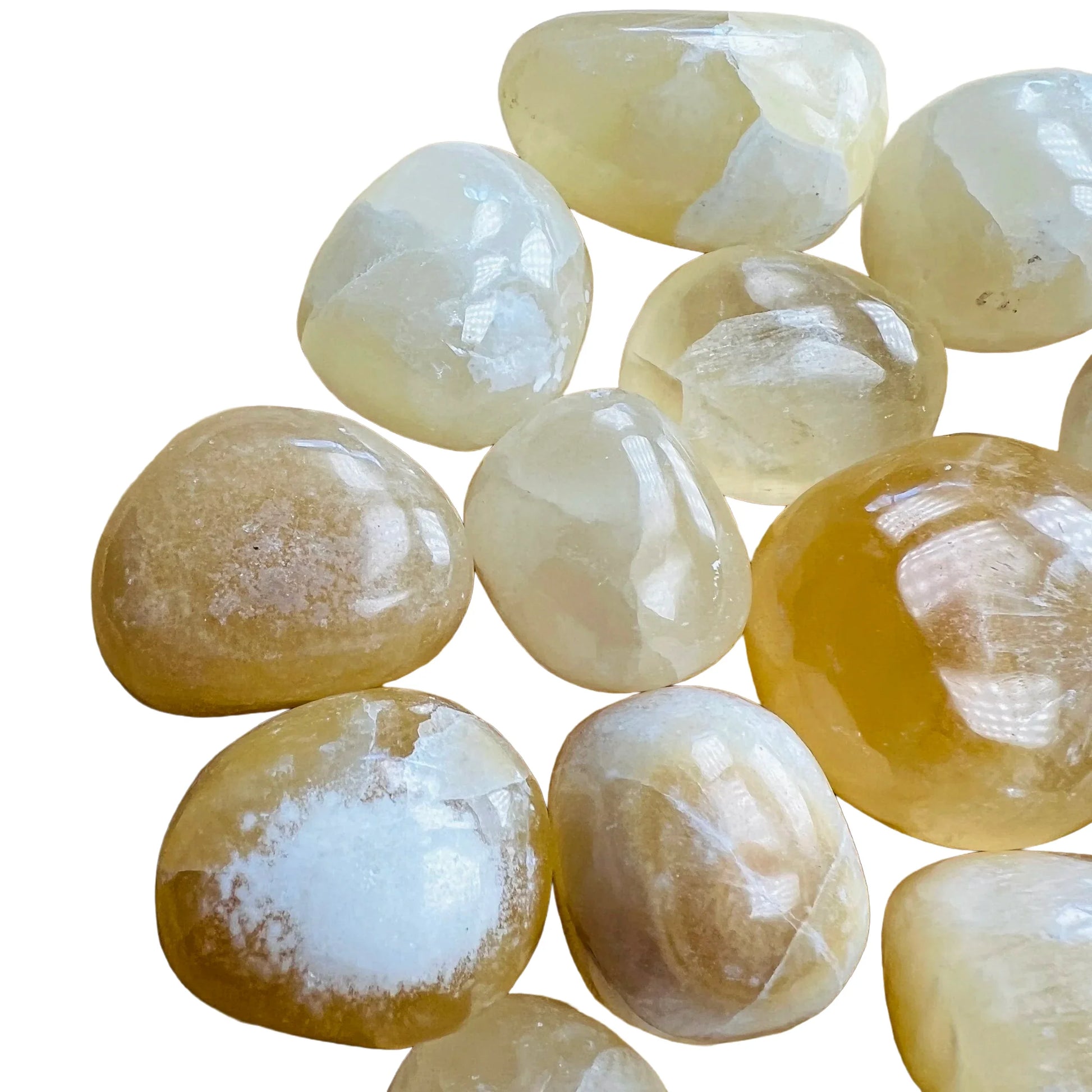 Plan view of Grade AA Honey Calcite tumbled stone, turned to for Confidence, showing soft luster.