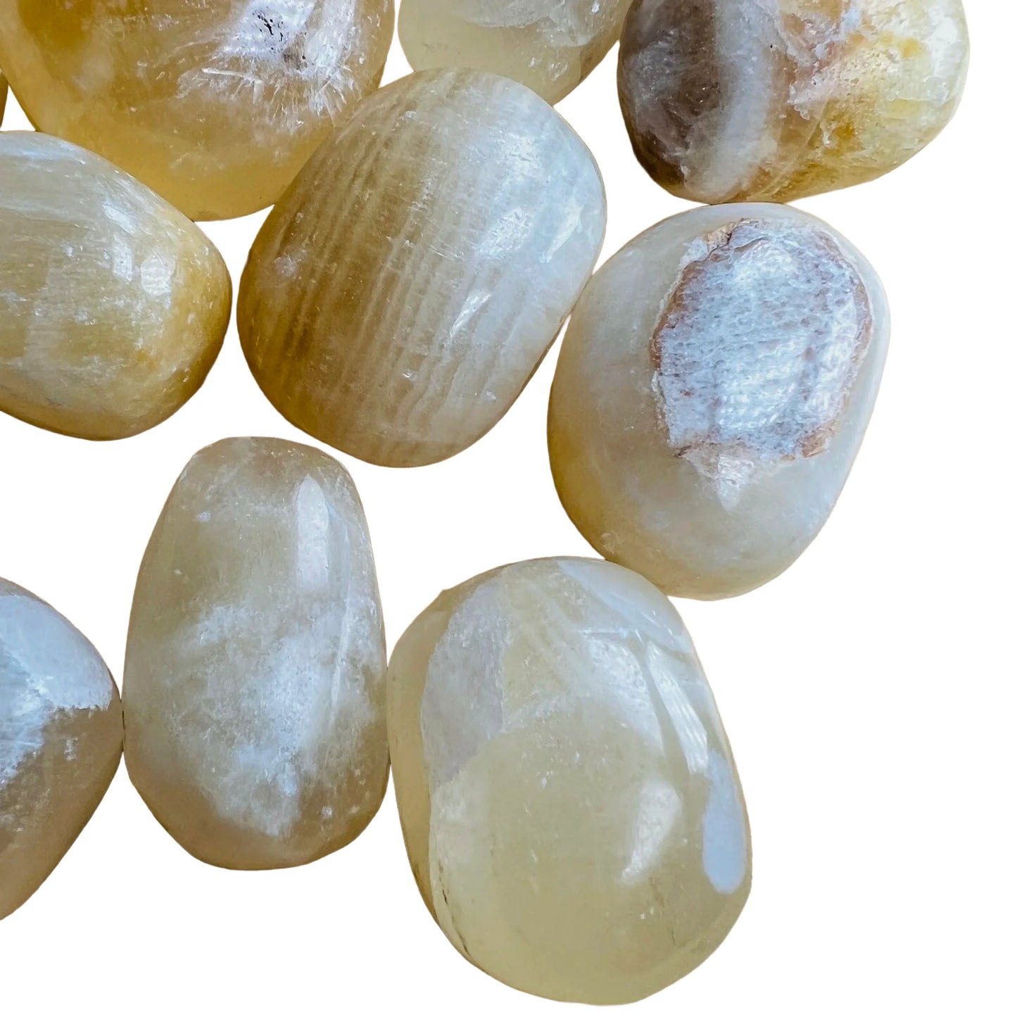 Bottom side of Honey Calcite tumbled stone, showing color depth.