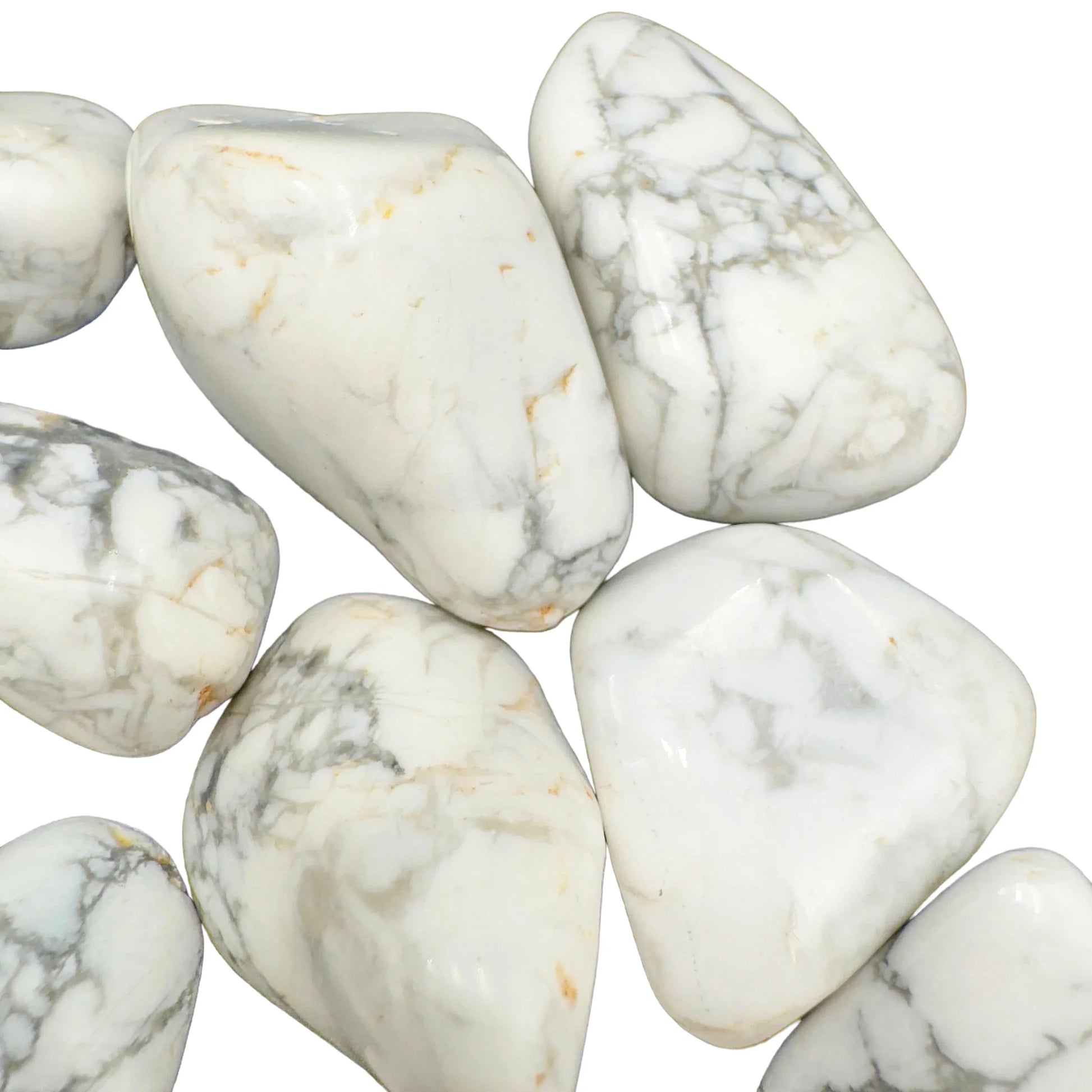In-hand view of one Howlite tumbled stone for scale, Zimbabwe-sourced, from Masvingo, Zimbabwe.