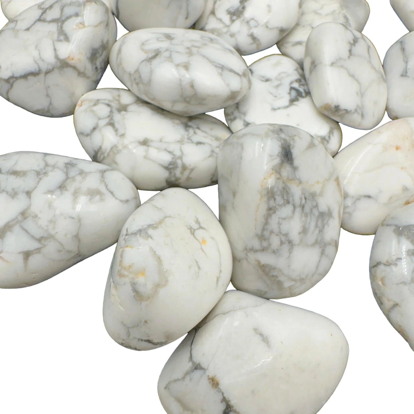 Side angle of Howlite tumbled stone, hand-selected from Masvingo, Zimbabwe, showing characteristic finish.
