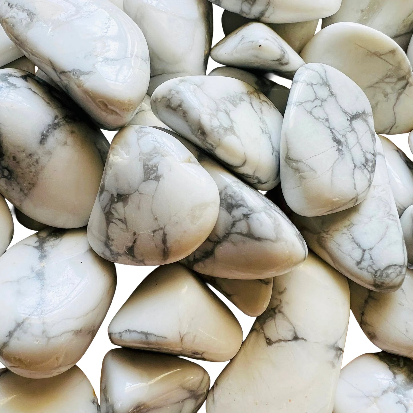 Sideways view of Howlite tumbled stone, showing soft luster.
