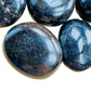 Side perspective of Iolite palm stone, showing natural sheen, from Madagascar.
