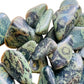 Up-close view of Kambaba Jasper tumbled stone, showing subtle veining.