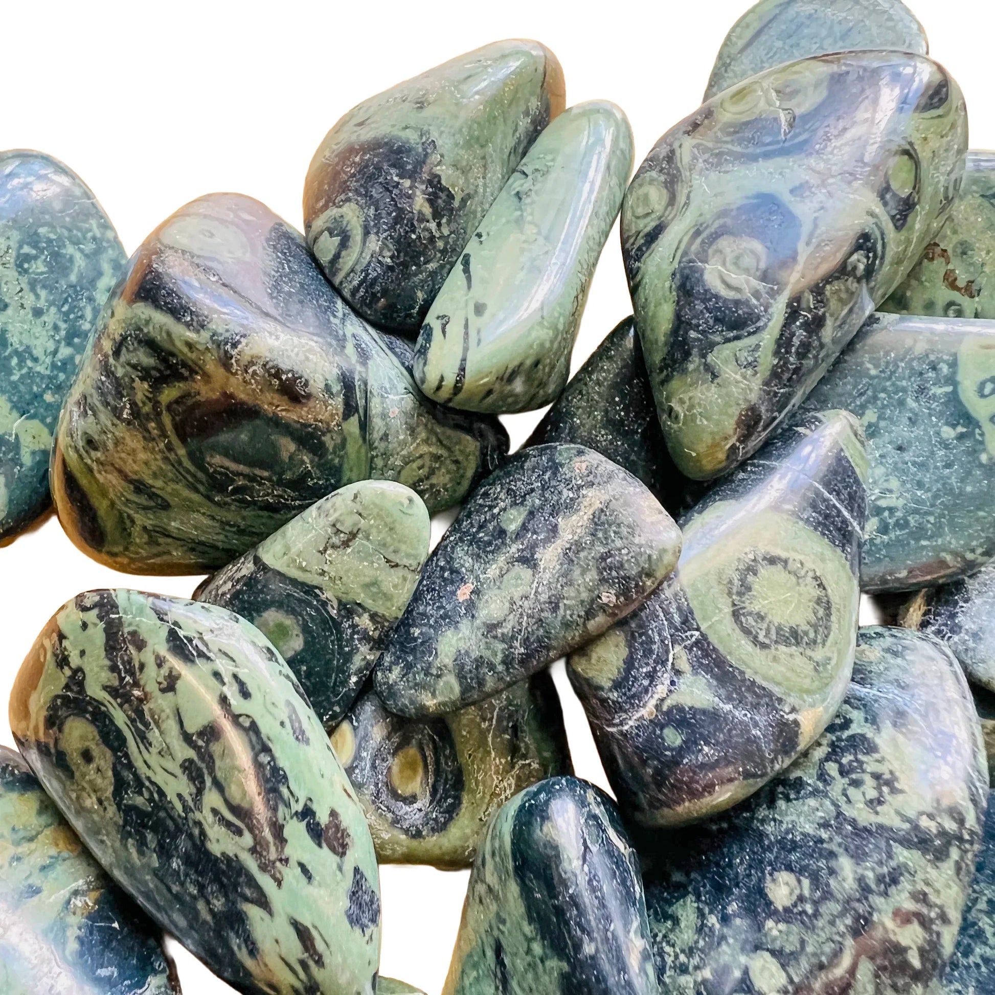Up-close view of Kambaba Jasper tumbled stone, showing subtle veining.